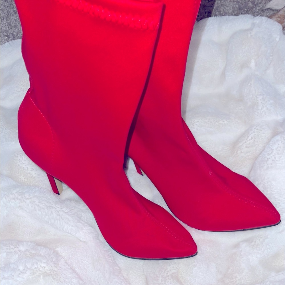 Used once like new tall stiletto red boots